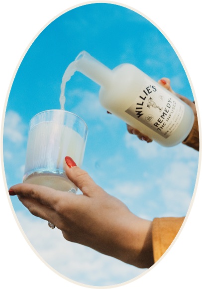 Pouring Willie's Remedy+ social tonic